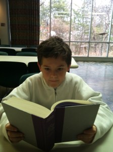 This is so obviously my kid. We sat across from each other and read. People thought it was weird. ;)