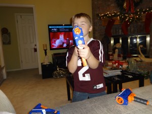 Greg loves his new take-apart nerf gun from Aunt April